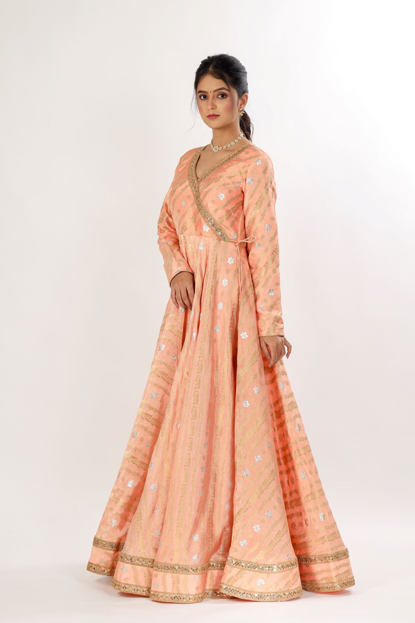 MANJYOT - Peach and gold Angrakha Gown with tassels attached