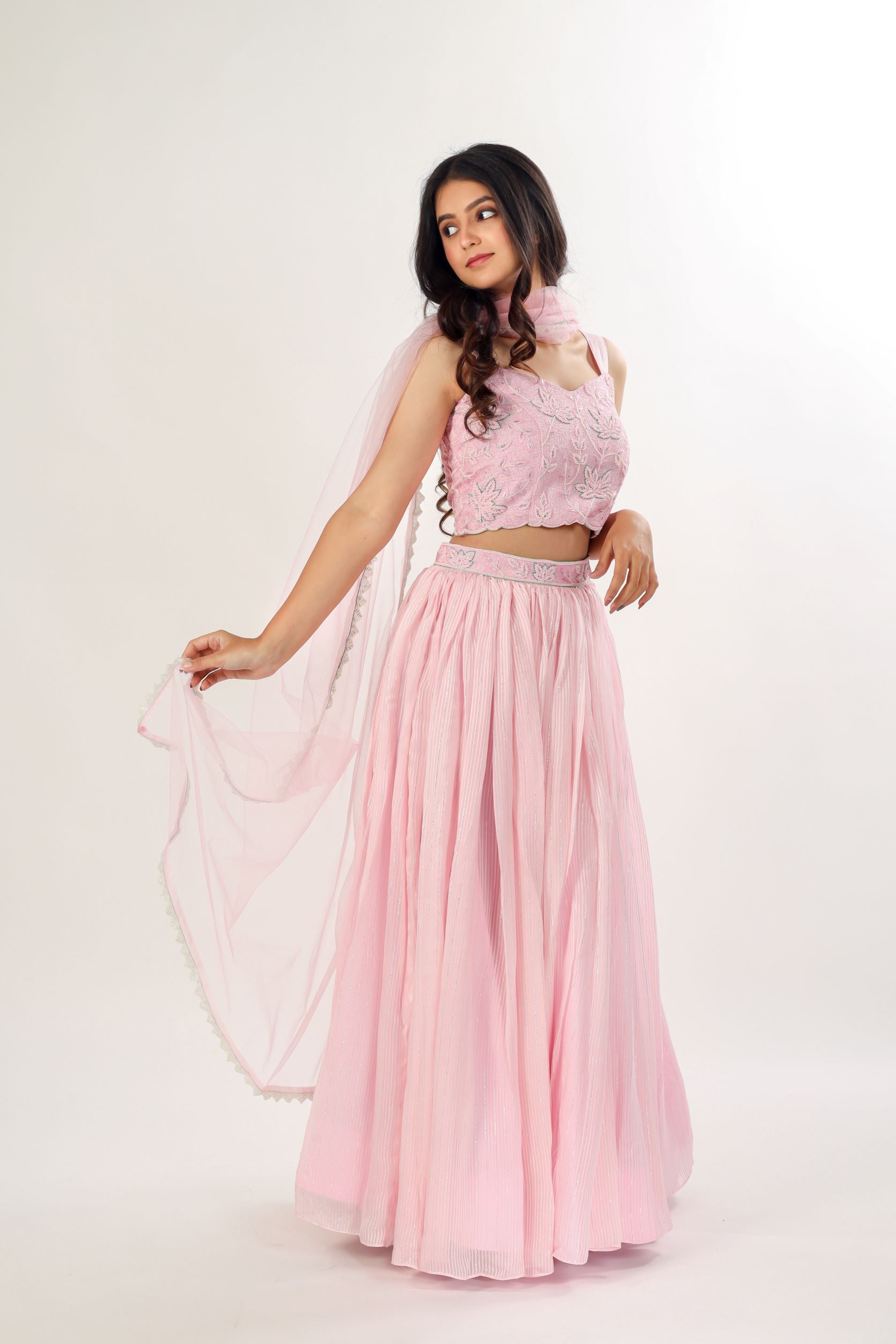 Mabia Boutique - Presenting the Silk Lehenga Collection- PARNIKA . An  elegant light teal and peach net lehenga with a beautiful pleated skirt  adorned with intricate Aari detailing has been carried so